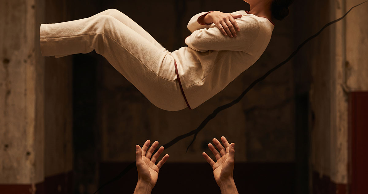 A person falls backward toward absent hands, representing the instant collapse of parasocial trust.
