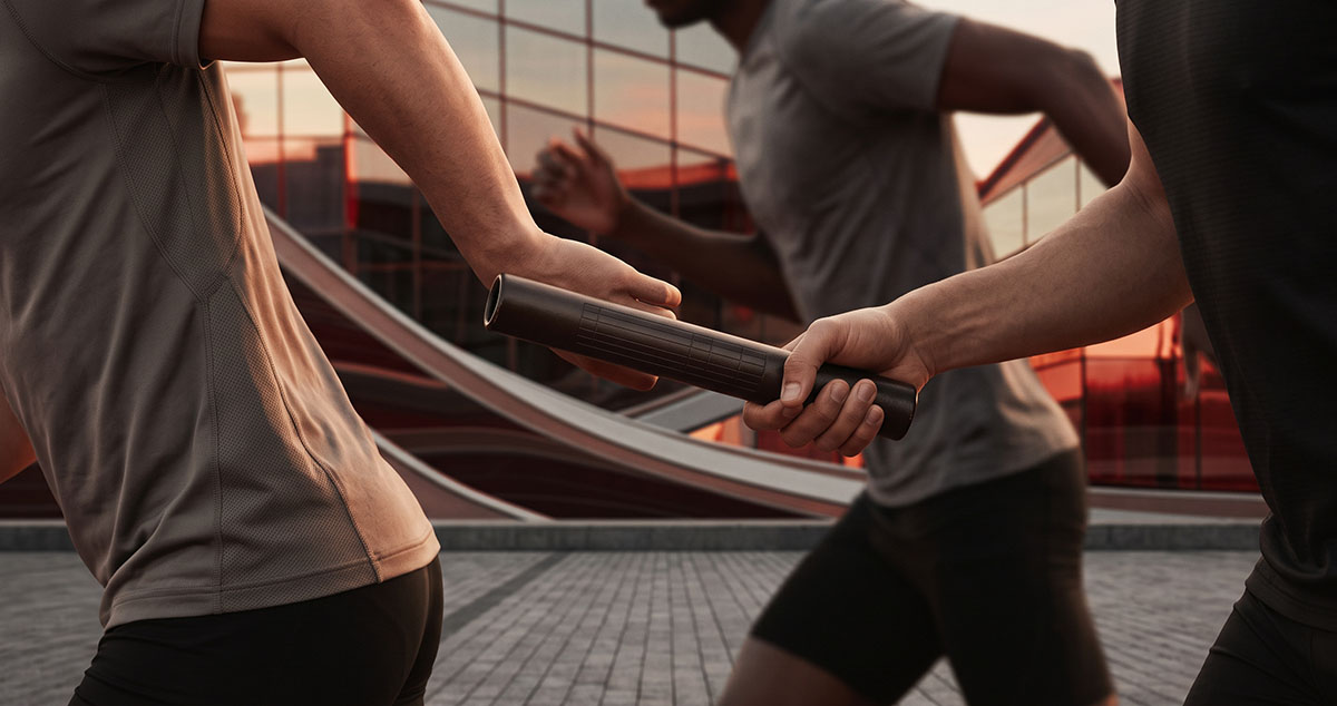 Relay baton passed cleanly between runners, symbolizing customer context preserved across a revenue system.